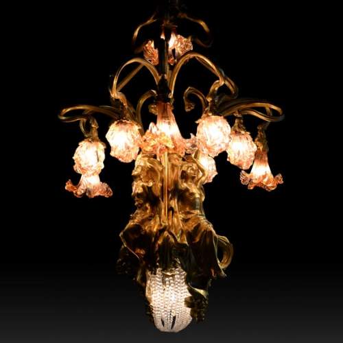 Beautiful antique Art Nouveau style chandelier in gilt bronze and molded glass with languid bodies and nine lights