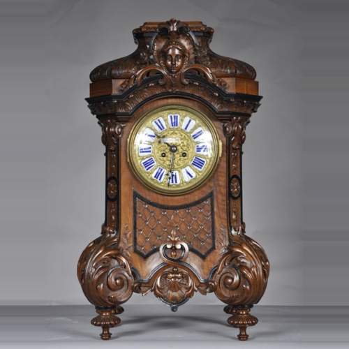Mazaroz (attributed to), Neo-Renaissance carved walnut cartel clock