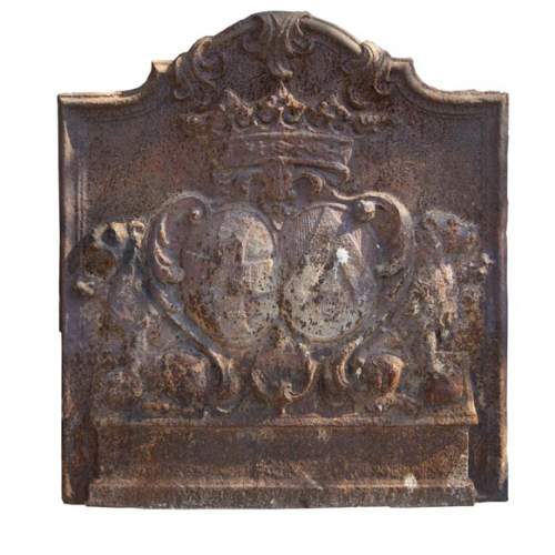 An old 18th century fireback with coat of arms and sitting lions