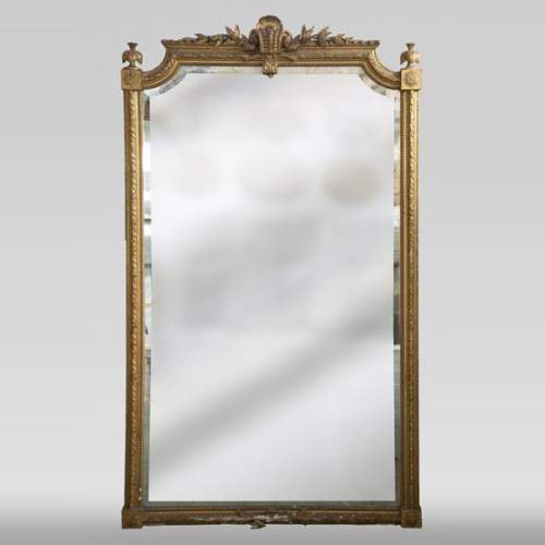 Antique gilded Trumeau, Napoleon III style, with a bevelled mirror