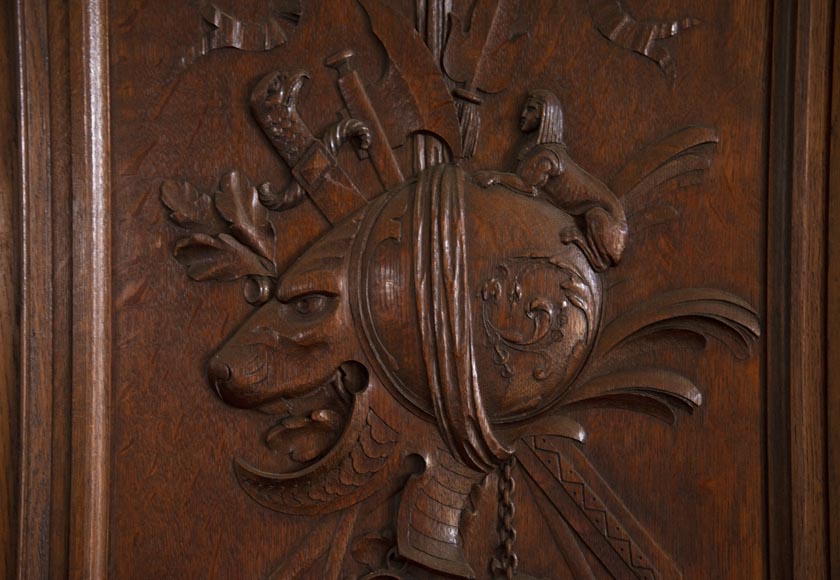 Double door in carved oak decorated with military trophies-5
