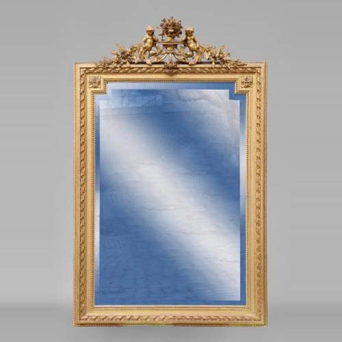 Beautiful antique Napoleon III style trumeau with putti and flowers decor in gilded stucco