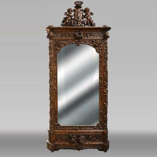 TAHAN (attributed to) — Large carved walnut armoire with mirror and naturalist decoration