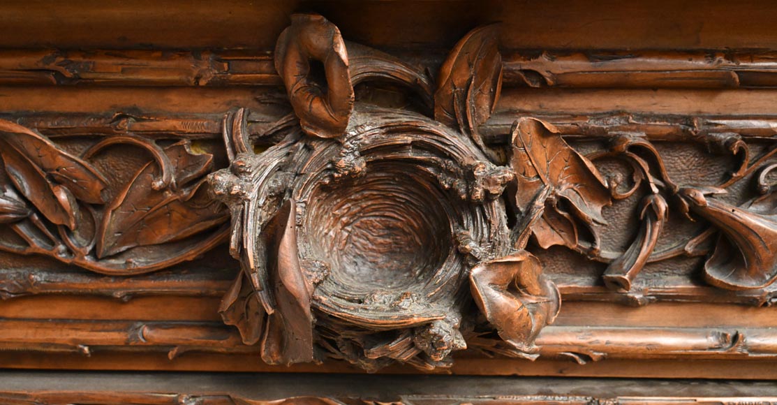 TAHAN (attributed to) — Large carved walnut armoire with mirror and naturalist decoration-2