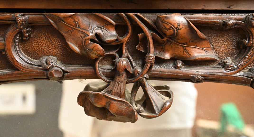 TAHAN (attributed to) — Large carved walnut armoire with mirror and naturalist decoration-4