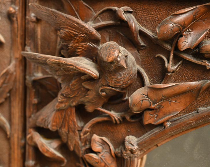 TAHAN (attributed to) — Large carved walnut armoire with mirror and naturalist decoration-5