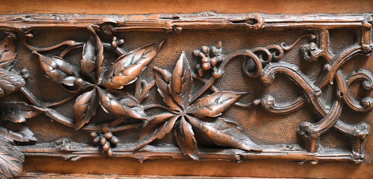 TAHAN (attributed to) — Large carved walnut armoire with mirror and naturalist decoration-10