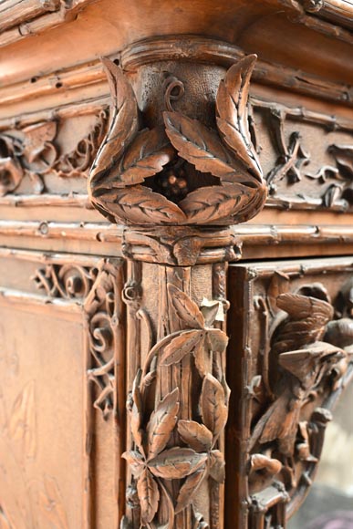 TAHAN (attributed to) — Large carved walnut armoire with mirror and naturalist decoration-14