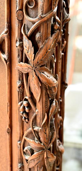 TAHAN (attributed to) — Large carved walnut armoire with mirror and naturalist decoration-16