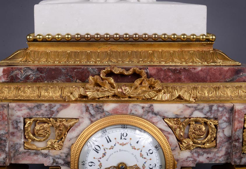 Peach blossom marble and gilt bronze clock surmounted by a statuary white marble   sculpture representing Phryne in front of his judges signed 