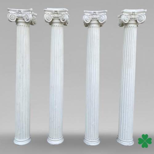Four Ionic-style columns in plaster