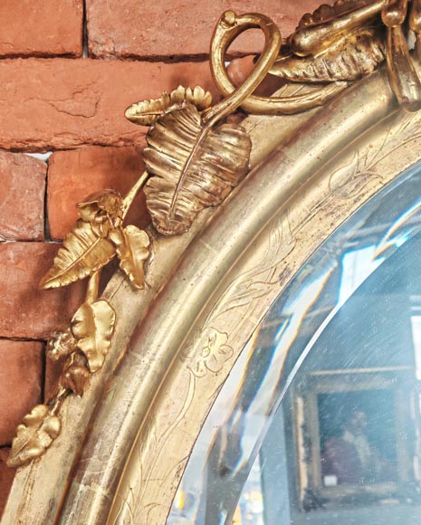 Oval gilt mirror in the Napoleon III style, featuring rich foliate ornamentation Oval gilt mirror in the Napoleon III style, featuring rich foliate ornamentation-5