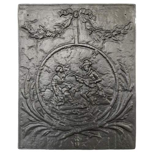 Fireback adorned with a romantic scene in a medallion