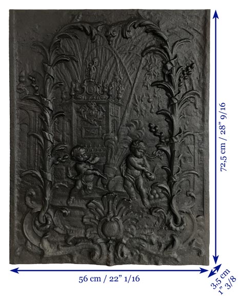 Cast iron fireback with putti firing a cannon-9