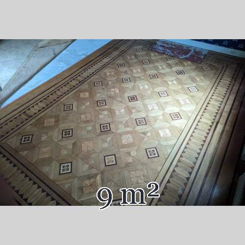 Parquet flooring with wood marquetery depicting diamond shapes and stylized flowers, late 19th century