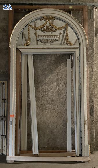 Carved, regilded and white-painted wooden paneling-2