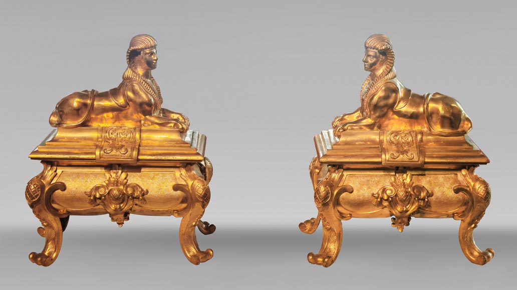 Pair of Napoleon III style gilt-bronze chenets featuring sphinxes-0