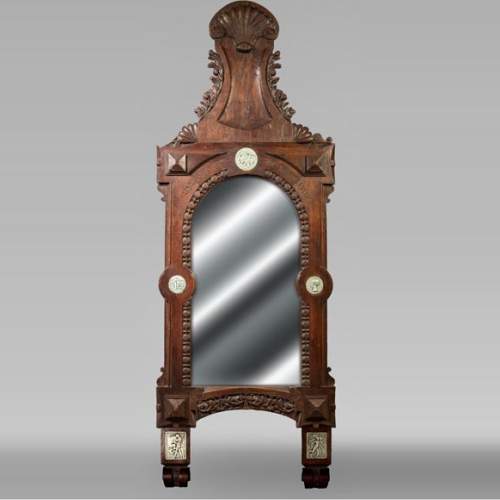 DECK Théodore (1823-1891), monumental oak mirror with green glazed faience medallions