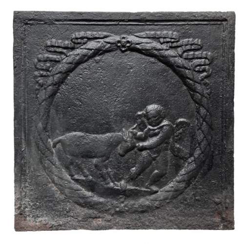 Fireback from the 18th century featuring a love playing with a goat