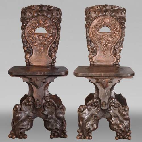 Group of sculpted wood chairs