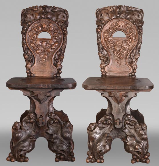 Group of sculpted wood chairs-0