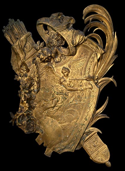 Union Centrale des Arts Décoratifs, decorative gilded bronze plaque in the form of a shield, featuring Winged Victory and trophies of arms Union Centrale des Arts Décoratifs, decorative gilded bronze plaque in the form of a shield, featuring Winged Victory and trophies of arms-1