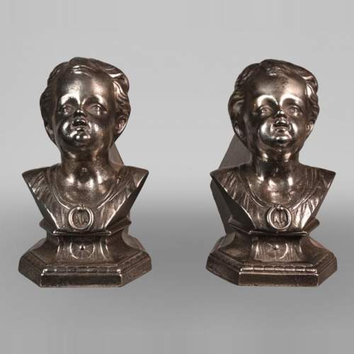 Pair of andirons with child busts