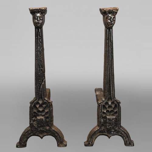 Pair of andirons with faces