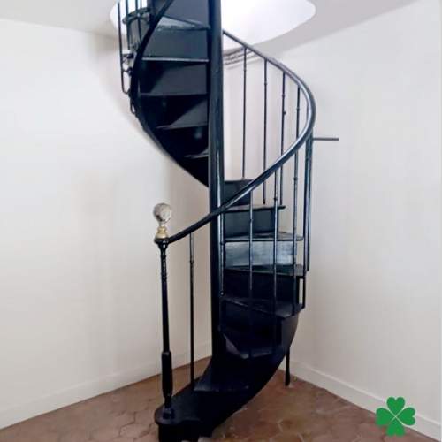 Spiral staircase in painted oak