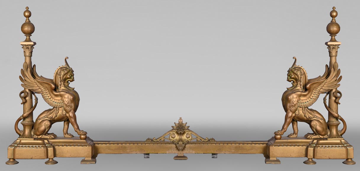 Pair of Egyptian-style gilt-bronze firedogs with confronting griffins-0