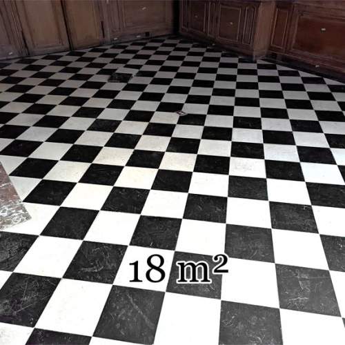 Checkerboard floor in stone and black marble .