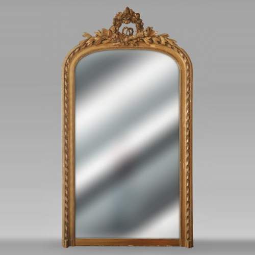 Louis XVI style gilded trumeau with rounded top decorated with an openwork wreath of flowers