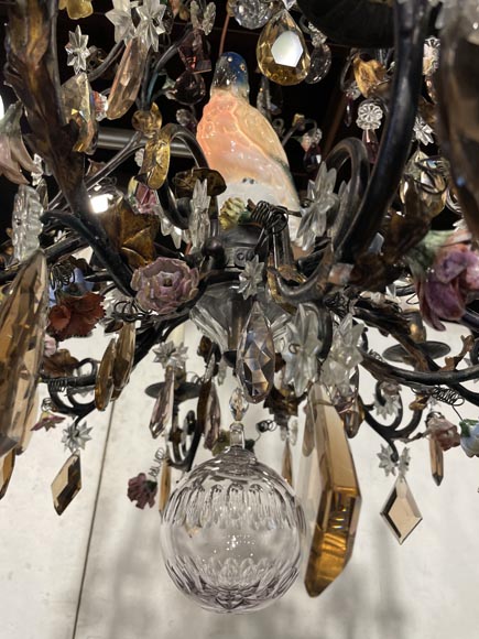 Patinated brass chandelier decorated with flowers and a polychrome porcelain parakeet-6