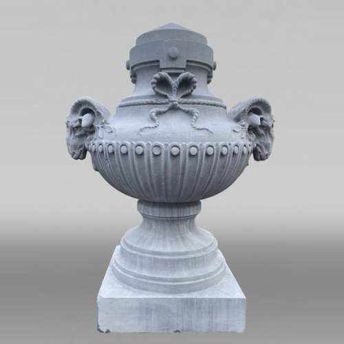 Large carved stone vase, Louis XVI style, adorned with ram heads