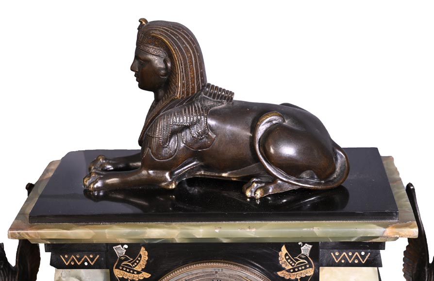 Egyptian Revival mantel garniture in black marble, green onyx, and gilt bronze-1