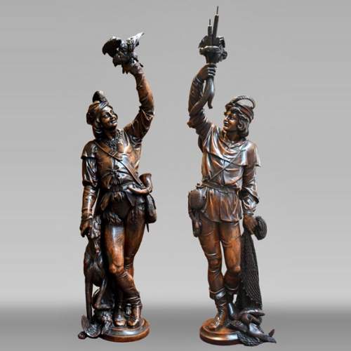 RIBAILLER and MAZAROZ, Pair of walnut statues of a hunter and a fisherman, after the 1855 Universal Exhibition