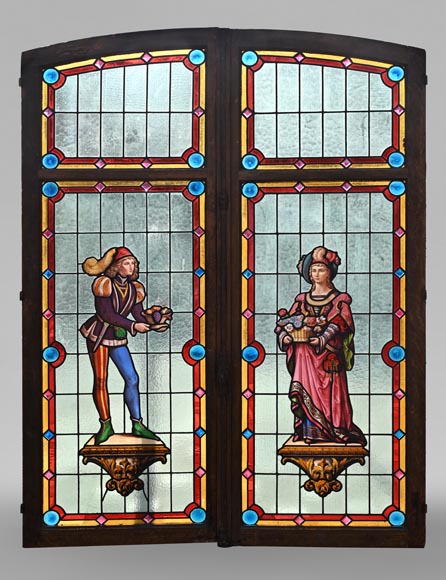 Double stained glass window in neo-Renaissance style depicting two figures with offerings-0