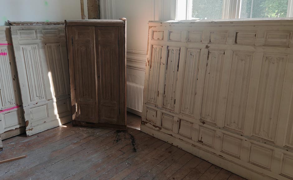 Neo-Gothic style oak wainscoting featuring a 