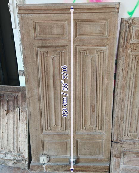Neo-Gothic style oak wainscoting featuring a 