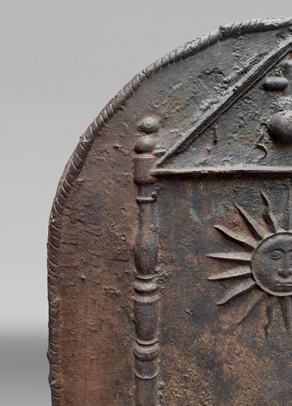 Cast iron fireback dated 1693, decorated with a radiant sun and architectural symbols-4