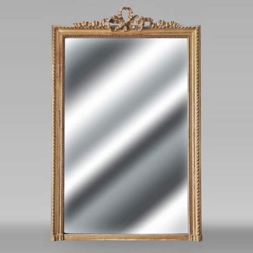 Louis XVI style gilded trumeau topped with a knotted ribbon