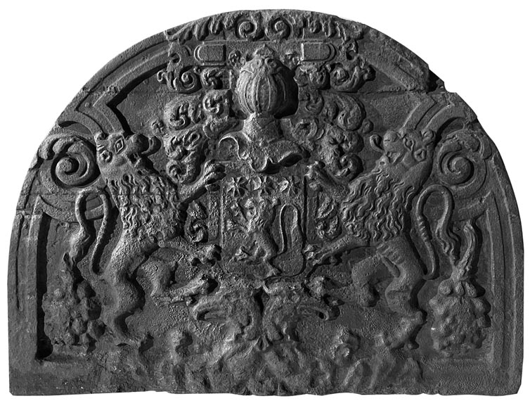 A semicircular cast iron fireplace plaque, decorated with a coat of arms, surmounted by a helmet and framed by lions. A semicircular cast iron fireplace plaque, decorated with a coat of arms, surmounted by a helmet and framed by lions.-0