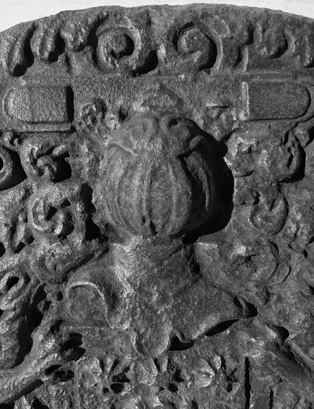 A semicircular cast iron fireplace plaque, decorated with a coat of arms, surmounted by a helmet and framed by lions. A semicircular cast iron fireplace plaque, decorated with a coat of arms, surmounted by a helmet and framed by lions.-3