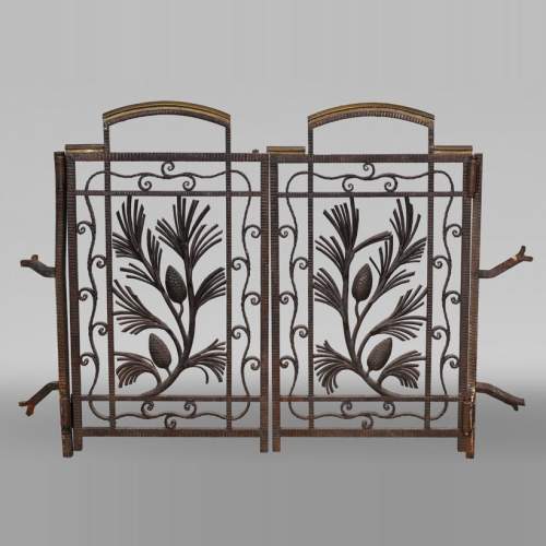 Wrought-iron fireplace spark guard with pine branch decoration, 1930s