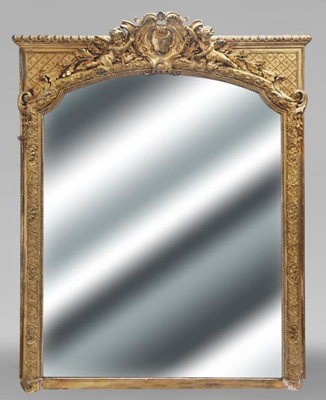 A richly gilded trumeau in the Napoleon III style, decorated with putti A richly gilded trumeau in the Napoleon III style, decorated with putti-0