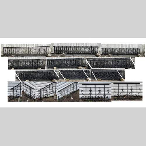 Set of wrought-iron railings featuring a design of scrolls and volute terminals, including both straight and raked sections