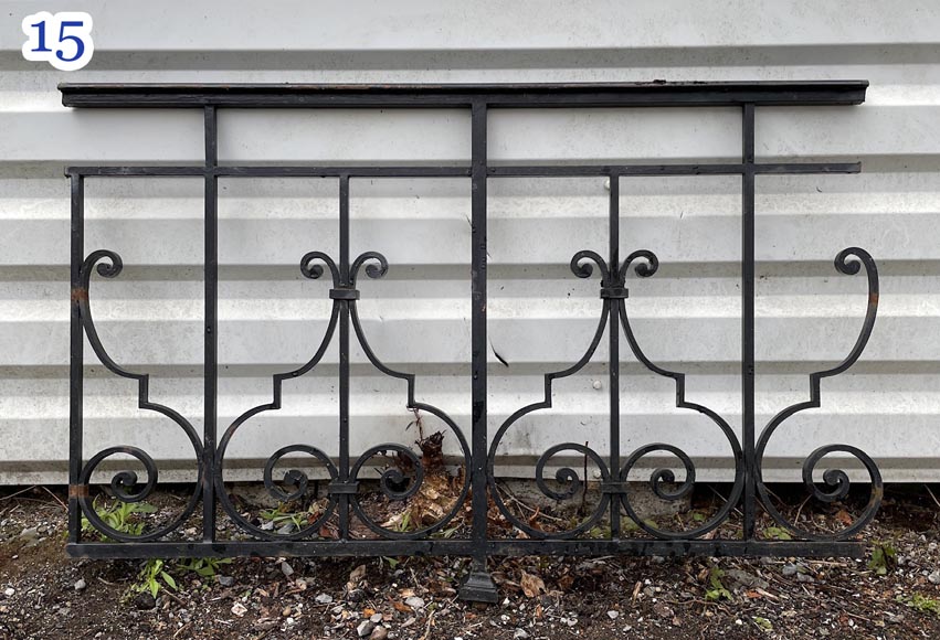 Set of wrought-iron railings featuring a design of scrolls and volute terminals, including both straight and raked sections-15