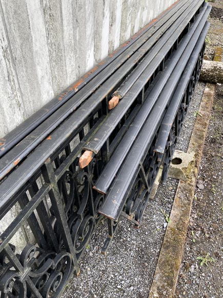 Set of wrought-iron railings featuring a design of scrolls and volute terminals, including both straight and raked sections-19