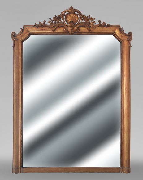 Gilt Louis XV style trumeau mirror surmounted by a shell motif Gilt Louis XV style trumeau mirror surmounted by a shell motif-0