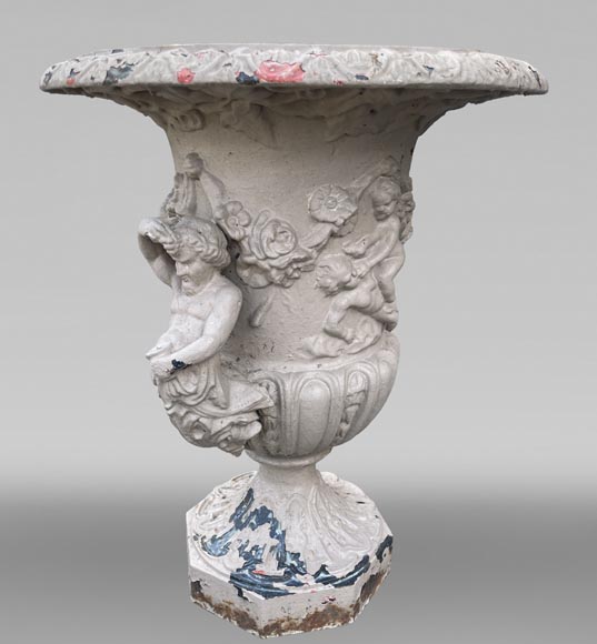 Cast iron garden vase with a frieze of cupids and handles formed as winged putti Cast iron garden vase with a frieze of cupids and handles formed as winged putti-2